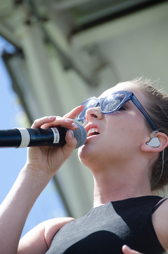 Georgia Nott, the lead singer of Broods, belts out their single, 