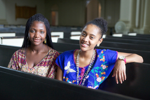 Charity Ntansah and Leondra Polk, a junior public health major and a senior psychology and social work dual major, respectively, sit inside Hendricks Chapel on Monday. Both were former members of On Point for College. 