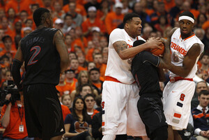 DaJuan Coleman (center) will miss approximately four weeks following surgery on his left knee, which will take place Tuesday.