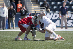 Brandon Conroy fights for a faceoff in Syracuse's 13-11 win over St. John's. Conroy went 8-of-19 at the X before Chris Daddio took over.