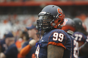 Ryan Sloan, defensive tackle, wears one of the redesigned football helmets during the SU vs. Tulane game on Sept. 15. One of the new helmets was auctioned for $2,020.