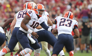 Terrel Hunt hands the ball off to Prince-Tyson Gulley early in SU's 59-3 loss to the second-ranked Seminoles.