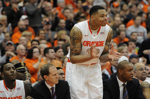 DaJuan Coleman claps from the Syracuse bench. Colemam played a season-low six minutes against Villanova on Saturday due to a knee injury as well as an unfavorable matchup against the Wildcats' faster bigs.