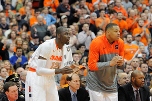 DaJuan Coleman (right) did not play in No. 2 Syracuse's 57-45  win over North Carolina on Saturday. The center logged three minutes in SU's previous game against Virginia Tech, but continues to nurse a lingering left leg injury. 