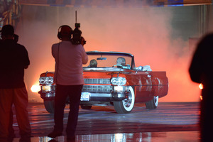 Syracuse women's basketball head coach Quentin Hillsman rolls out to Orange Madness in an old-school red car. 