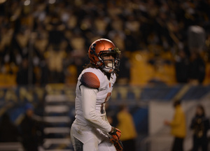 Syracuse wide receiver Steve Ishmael adjusts his left glove as a chunk of grass is stuck to his facemask. The freshman finished the game with six catches for 97 yards.