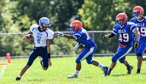 AJ Burnett (No. 7) contributed to three touchdowns (two passing, one rushing) in his first varsity game for Bishop Grimes on Saturday.