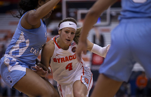 Tiana Mangakahia drives between two defenders during Syracuse's win over North Carolina. 