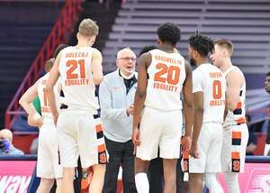 Syracuse kept its NCAA Tournament hopes alive by hanging on for a 72-70 win over UNC, Syracuse's first top-40 win in the last two years.