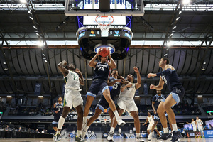 Cole Swider (No. 10, right) shot 40.2% from 3 last season for Villanova. 