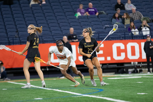 Despite Syracuse's Superia Clark consistently face-guarding Madison Taylor, the junior scored five second-half goals to bring Northwestern a 12-8 win.