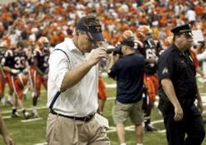 Doug Marrone trudges off the Carrier Dome field after Syracuse's 23-20 overtime loss to Minnesota. SU blew a 20-14 halftime lead in Marrone's debut as head coach.