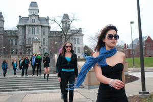 Students freeze on the Quad as part of a flash mob Wednesday afternoon to promote fashion event Lights, Camera, Fashion!