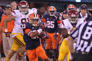 Syracuse Orange running back Prince-Tyson Gulley dodges defenders. 