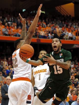 Wagner guard Kenneth Ortiz slices into the lane to attempt a layup.