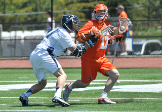 Syracuse attack Dylan Donahue tries to escape a Villanova defender.