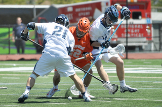 Syracuse midfielder Jojo Marasco fights for a ground ball with Villanova long-stick midfielder John LoCascio.