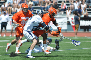 Syracuse midfielder Hakeem Lecky fights for the ball. 