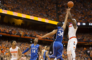 Fair elevates over Andre Dawkins and connects on a jumper.