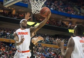 Fair finishes a reverse layup around a WMU defender.