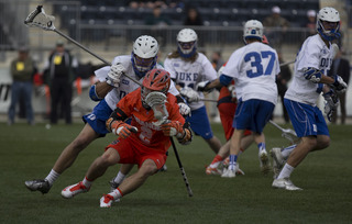 Kevin Rice is defended by Chris Hipps of Duke. Rice finished the game with 5 assist.