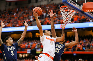 Gbinije goes up with his right hand over Sheldon Jeter.