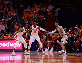 Tyus Battle and Oshae Brissett defend on the perimeter.