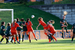 Senior Taylor Bennett heads the ball into the goal for SU's first tally of the night.
