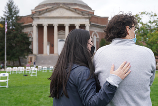 Samantha Armetta, who represents Alexander Lowenstein, wraps her arm around Caleb Sheedy, who represents Theodora Eugenia Cohen, after the ceremony ends.