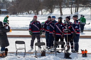 One of the teams participating in the Syracuse Pond Hockey Classic gathers for a team photo to celebrate playing once again. 