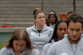 Remembrance Scholar Amanda LaLonde sits in the seat that the student she represents, Wendy Lincoln, occupied on the plane. The seat was labeled “We remember Wendy K. Lincoln.” 